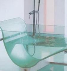 bathtub-waterfall-large-bathtub-unique-round-bathtub-designs-ideas-unique-bathroom-faucets-unique-bathroom-futuristic-corian-chaise-lounge-bathtub-design-with-attractive-see-through-clear-glass-body-s