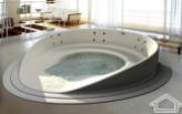 large-bathtub-unique-round-bathtub-designs-ideas-unique-bathroom-faucets-unique-bathroom-futuristic-corian-chaise-lounge-bathtub-design-with-attractive-see-through-clear-glass-body-side-and-chromed-fr
